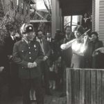 Lynn Newdome plays the anthem in front of 167 Upland Rd, 1982