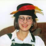 Vivi in hat with feather